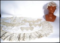 A collection of stunning early 20th century embroidery / lacework. The items to include a silk and