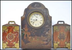 An early 20th century novelty biscuit / sweet tin in the form of a mantle clock depicting