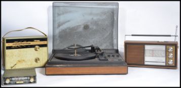 A group of vintage 20th century retro radios , record players etc. along with a pair of vintage