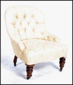A 19th century Victorian mahogany button back nursing chair, recently upholstered raised on mahogany
