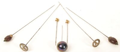 A collection of ladies hat pins dating from the 19th century to include gold examples, two with