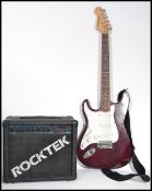 A 20th century six string electric left handed fender style  guitar by Helmesmen together with an