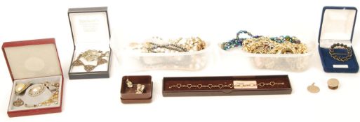 A group of vintage costume jewellery to include a hallmarked 9ct gold St Christopher's necklace