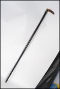 A 19th century Victorian walking stick cane having a silver hallmarked collar. The tapering ebonised