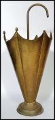 An early 20th century brass stick stand in the form of an upturned umbrella. 62cm tall.