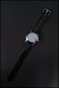 A vintage Gem Nove wrist watch having a mother of pearl dial with baton and roman numerals . Set