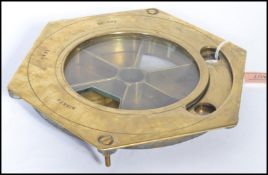 A 19th century Nixey's brass patent money till of hexagonal form with glass cover. Stamped Nixeys.