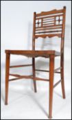 A 19th century Victorian bedroom chair designed by Edward William Godwin (1833-1886). The walnut