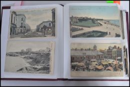 Postcards; an album of assorted vintage postcards, largely views of seaside towns / villages. Many