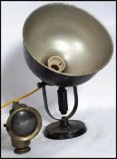 A vintage mid century industrial black spot desk lamp on terraced base with large pendant shade in