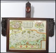 A 19th century carved black forest oak picture / map frame with carved Flemish oak mask mounts