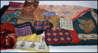 A collection of vintage 20th century silk scarves in the manner of Hermes to include various