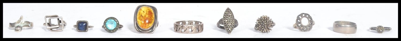 A collection of eleven vintage silver rings to include both ladies and gents examples to include