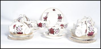 A vintage mid 20th century Colclough 12 person tea service in a floral pattern consisting of cups