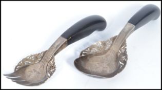 A Chinese silver pair of salad servers serving cutlery having ebonised wooden handles with an