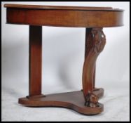 A Victorian mahogany Duchess console table being raised on shaped front support with lower tier on