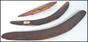 Two vintage 20th century Australian Aboriginal boomerangs with a small carving of a lizard. Please