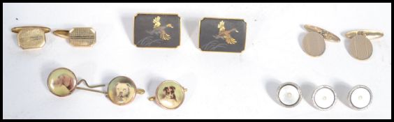 A group of vintage jewellery buttons and cuffs to include pictorial dog buttons , mother of pearl