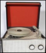 A vintage 20th century 1960's Dansette four speed portable record player in a two - tone finish.