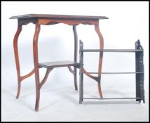 An early 20th century Edwardian mahogany inlaid occasional table raised on splayed legs together