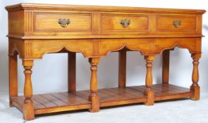 An excellent large  oak country dresser base of impressive size being raised on turned bulbous