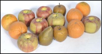 A group of early 20th century ceramic fruit ornaments to include oranges and apples. Hand painted