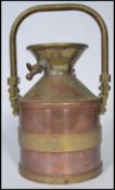 A vintage 20th century four gallon copper petrol measure by Wragg Brothers of Wickford, Essex.