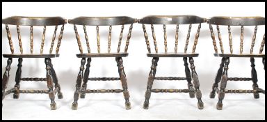 A set of four 20th century ebonised Captain style ebonised smokers bow styled country dining