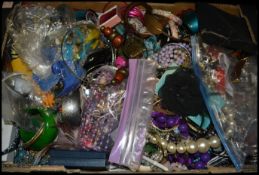 A large collection of vintage and contemporary costume dress jewellery to include bracelets,