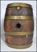 A vintage early 20th century point of sale / bar oak and four ring copper coopered drinks barrel.