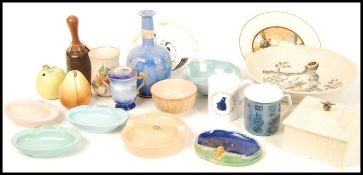 A collection of Royal Doulton to include Ashtrays , honey pot , cups, pear condiments , bowls , vase
