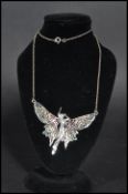 A sterling silver necklace chain having a plique a jour fairy pendant. Weighs 11 grams.