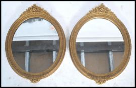 A pair of 19th century Victorian ornate wall mirrors having carved gilt frames. The central mirror