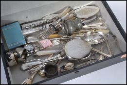A collection of silver plated items including spoons , tongs , serving knives , napkin rings ,