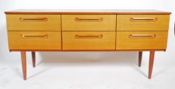 A retro 20th century teak wood sideboard, six drawers raised on shaped supports united bt