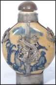 A 19th century Chinese perfume scent bottle having blue painted decoration with silver plated dragon