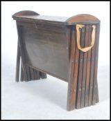 A World War II British officers oak framed campaign folding bed by Cabinetta.