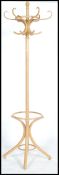 A vintage 20th century Thonet style bentwood hat stand being raised on splayed legs with s-shaped