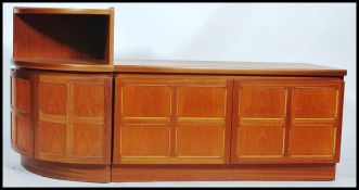 A vintage mid century teak wood Parker Knoll side cabinet unit with quarter panel front together