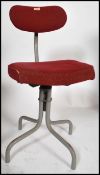 A retro mid century Tansad Industrial office - clerks swivel chair. Raised on a tubular metal base