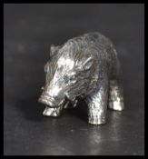 A sterling silver miniature figurine of a wild boar. Weighs 13 grams.