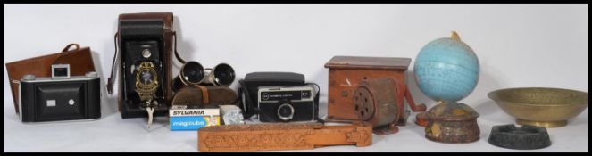 A collection of vintage items to include a wooden money box with initials T.S a tin desk top globe ,