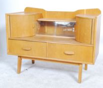 A vintage retro teak wood sideboard / dressing table series of drawers raised on shaped tapering
