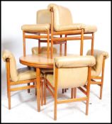 A 20th century retro teak wood Danish inspired dining room suite of six chairs and matching