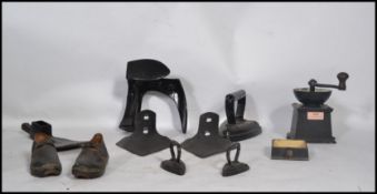 A collection of items to include a vintage coffee grinder, shoe last, axe head, clogs etc please