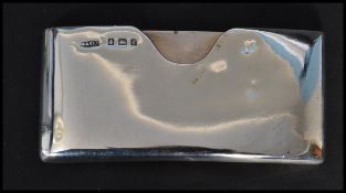 An early 20th century Edwardian silver hallmarked curved card case / holder bearing hallmarks for