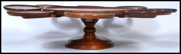 A 19th century Victorian mahogany and oak lazy Susan sectional serving plate having a revolving