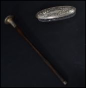 A silver hallmarked Edwardian parasol handle together with a silver hallmarked lidded dressing table