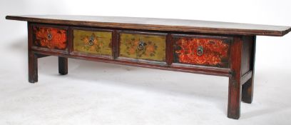 An early 20th century antique Chinese fir wood low four drawer alter table having handpainted floral