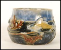 A Royal Doulton stoneware sugar bowl, the design attributed to George Tinworth, the body decorated